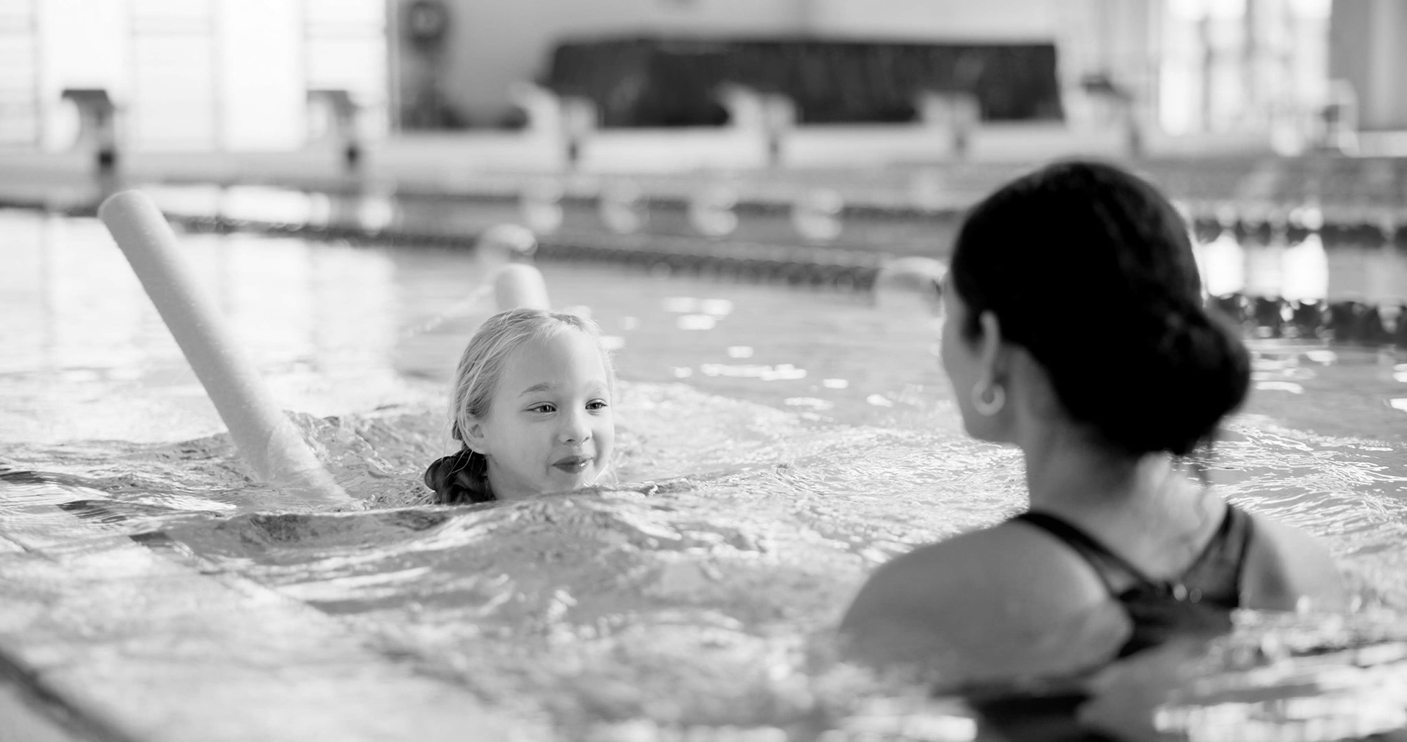 image of girl learning to swim
